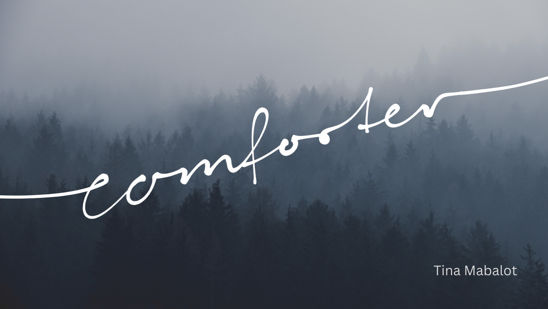 The title of comforter in cursive written over a forest with fog and the authors name on the bottom right